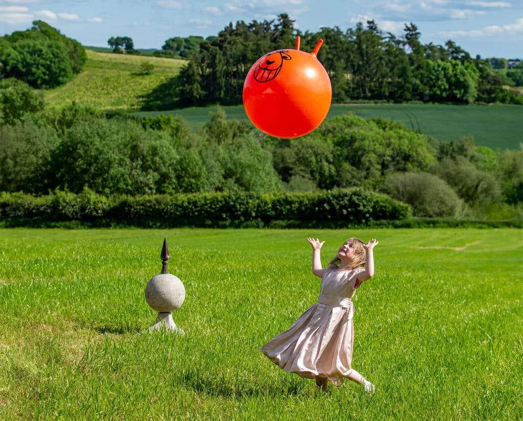 Little girl playing in the sunshine