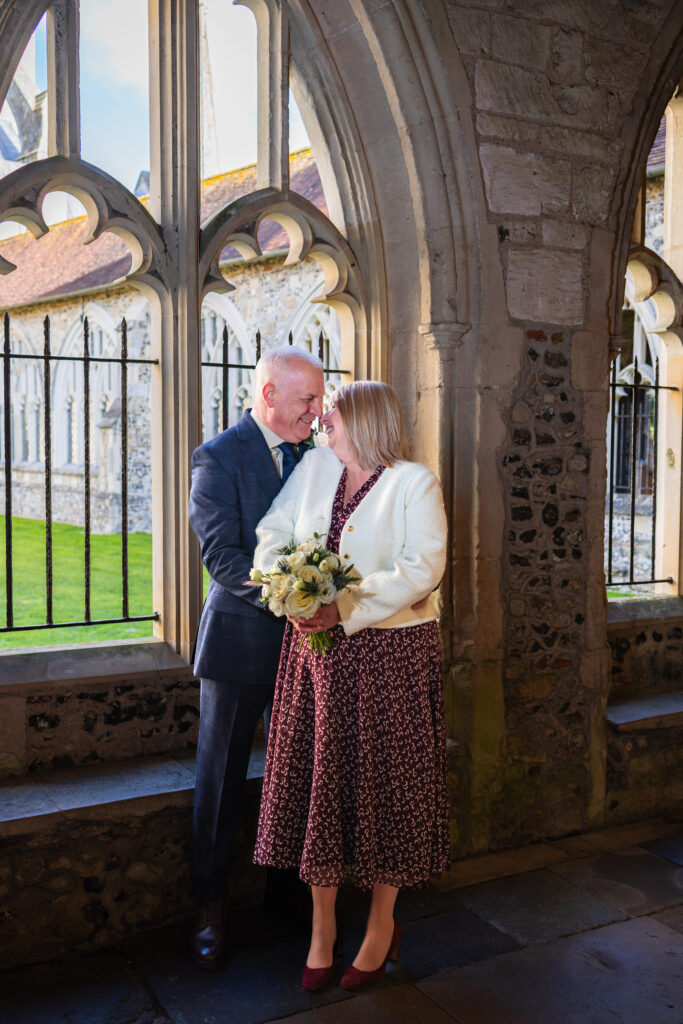 Couple portraits in Chichester Cathedral cloisters