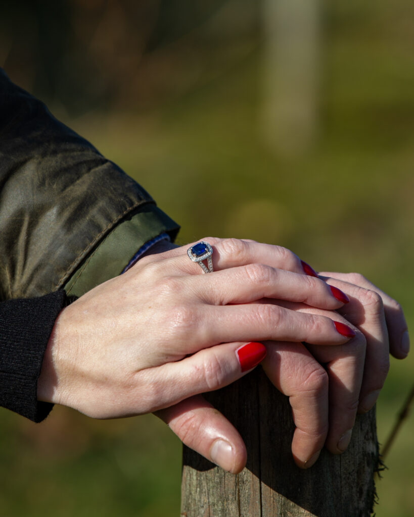 showing off her engagement ring