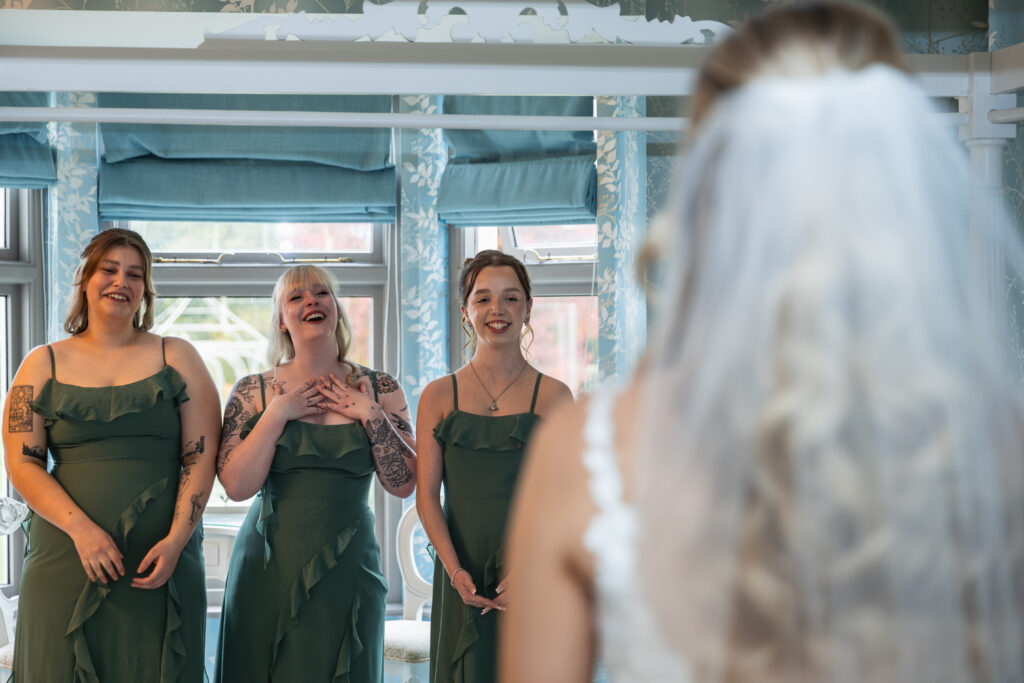Bridesmaids emotional reaction to first look at their bride