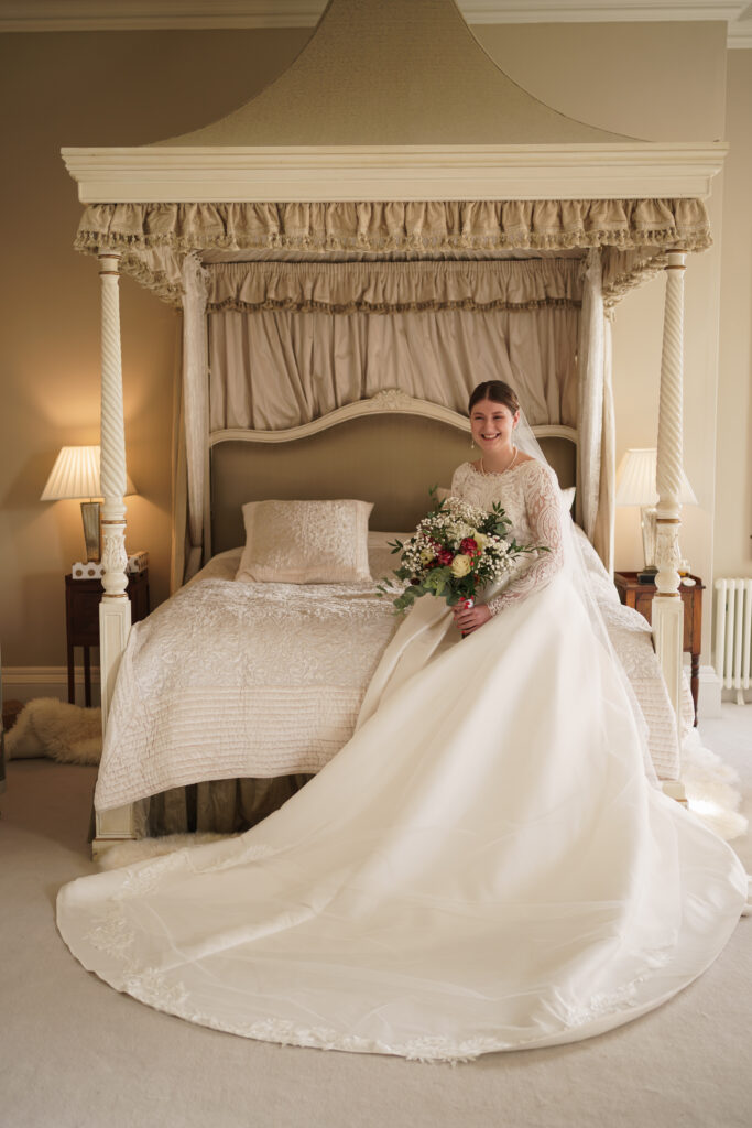 bride portrait sitting on her bed